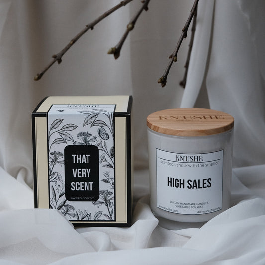 Scented candle  with the smell of "HIGH SALES"