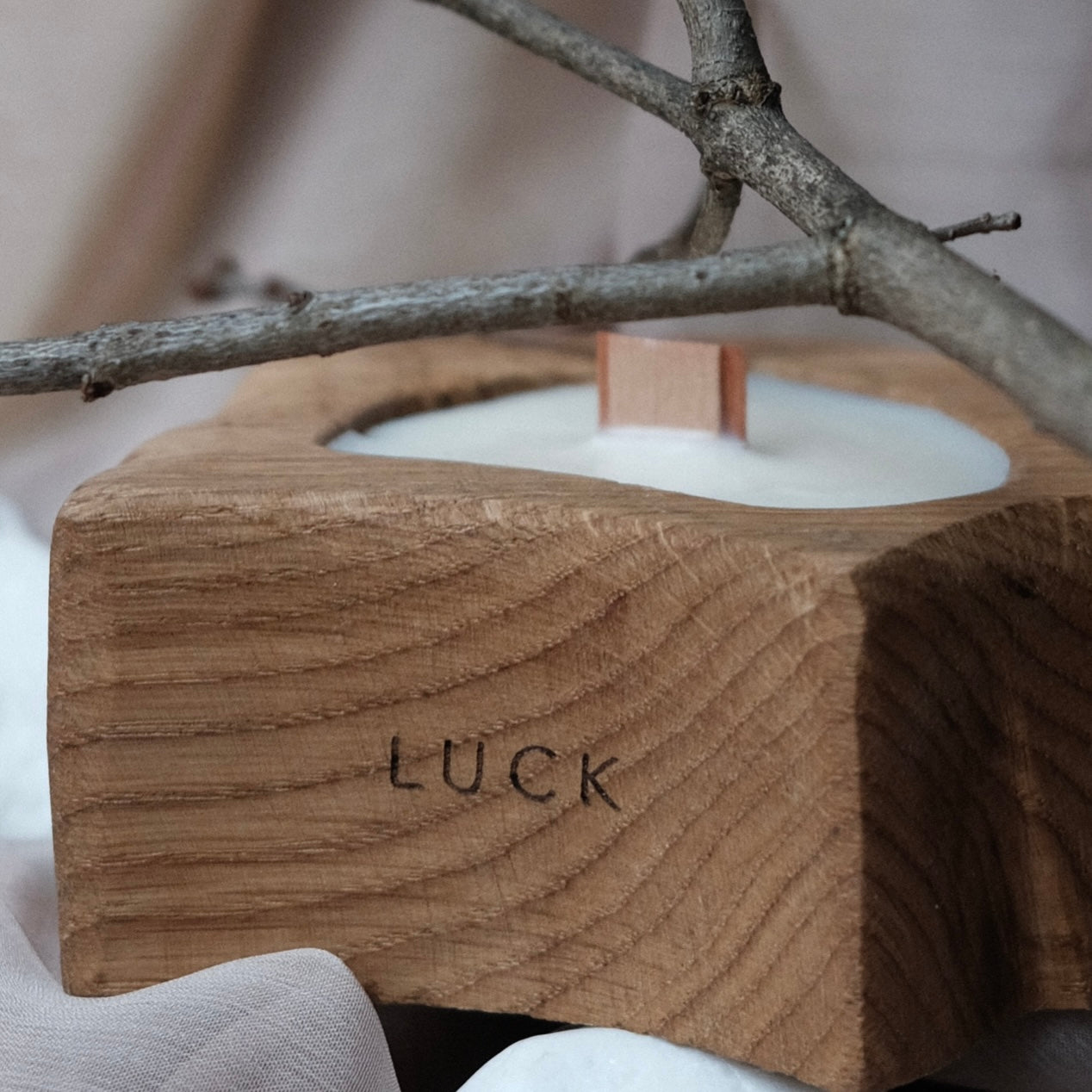 Exclusive aromatic candle in a wooden oak candlestick and a crackling wooden wick - LUCK.