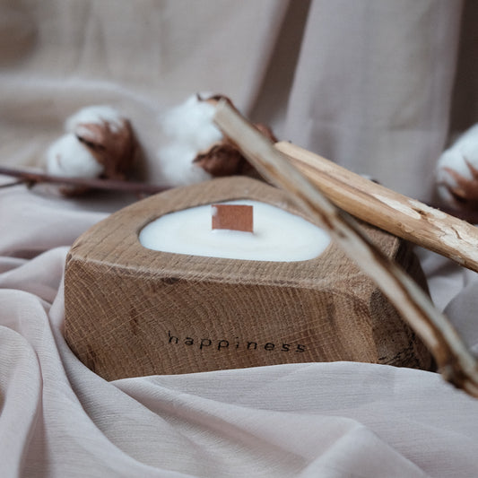 Exclusive aromatic candle in a wooden oak candlestick and a crackling wooden wick - HAPPINESS.